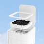 Smart trash can with lid open, demonstrating an automatic bag being sealed against a blue sky background.